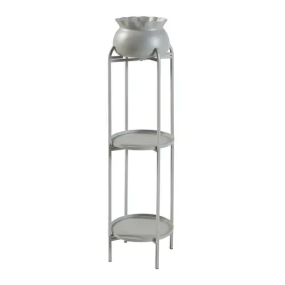 A light gray metal plant stand with a light gray pot on top and two circular shelves.