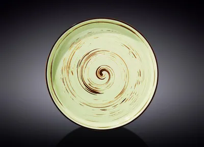A single plate with a spiral design is shown against a dark, gradient background.