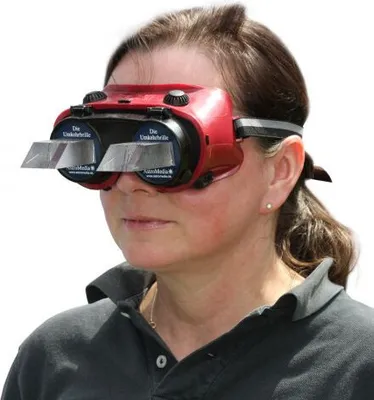 A woman wearing a red and black device over her eyes.