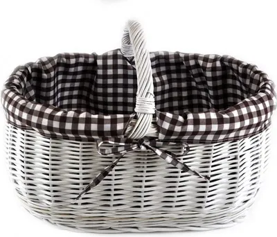 A white wicker basket with a brown and black checkered lining and a matching bow.