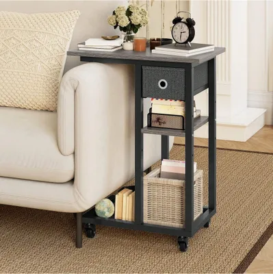 A side table with storage next to a sofa, in a living room setting.