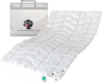 A white duvet and its storage bag are displayed on a white background.