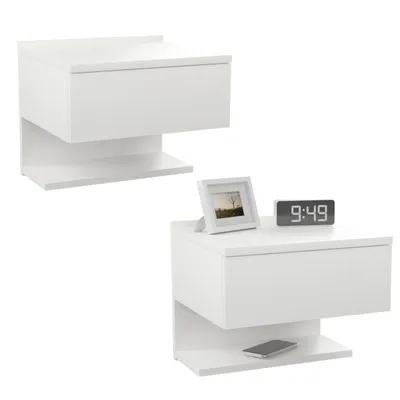 Two white wall-mounted nightstands are shown against a white background. One is positioned higher and to the left, while the other is lower and to the right. The lower nightstand has a framed picture and a digital clock on top, and a smartphone on the shel