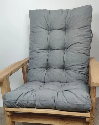 A grey cushion on a wooden chair.