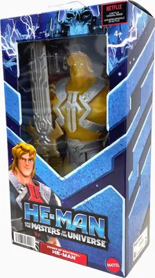 A toy action figure of He-Man from Masters of the Universe, displayed in its retail packaging.