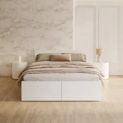 A bedroom scene with a bed, nightstands, and decorative wall paneling.