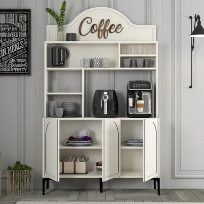 A white coffee bar cabinet with various coffee accessories displayed on shelves.