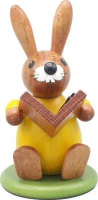 Imagen del producto de Decoración de Pascua: Conejo de Pascua con libro, de colores, altura 9 cm. Nuevo