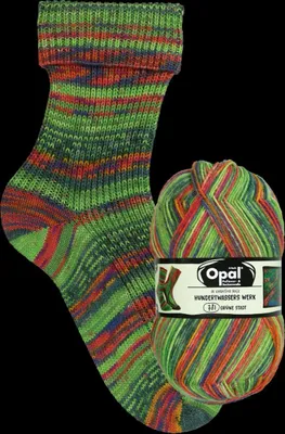 A knitted sock and a ball of yarn with the same pattern, displayed against a black background.