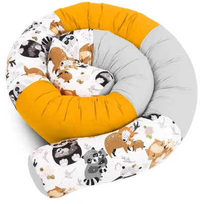 A coiled baby bed bumper with a woodland animal print.