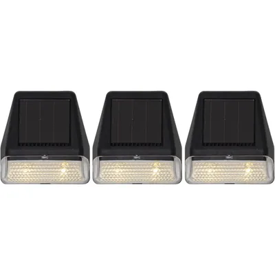 Three black and clear solar-powered pathway lights are arranged in a row against a white background.