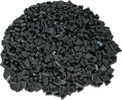 A pile of small, dark gray, quarter-circle shaped LEGO pieces.