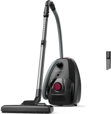 A black and gray bagless vacuum cleaner with a red accent is shown against a white background. A crevice tool accessory is visible to the right.