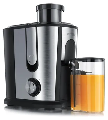 A product shot of a juicer with a pitcher of juice next to it.