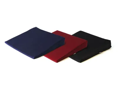 Three wedge cushions are displayed on a white background.