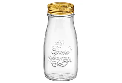A clear glass bottle with a gold lid.