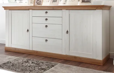 A sideboard with drawers and doors, set against a light gray and white background.