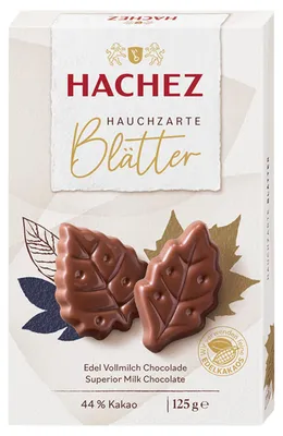 Produktbild von Hachez Schokolade Hauchzarte Blätter Edel Vollmilch (125g Packung) + usy Block