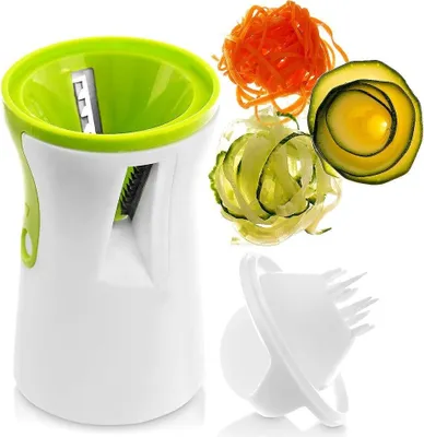 A spiralizer and the vegetables it has cut are displayed against a white background.