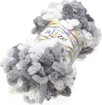 A ball of fluffy yarn in shades of gray and white.