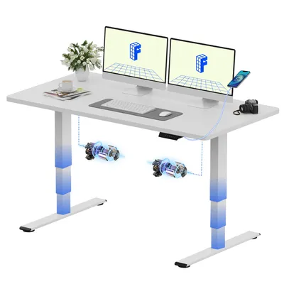 A white standing desk with dual monitors, keyboard, mouse, a phone, and a camera.