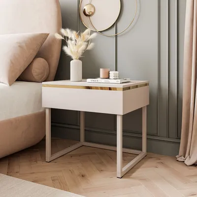 A bedroom scene featuring a nightstand next to a bed, with decorative elements and curtains.