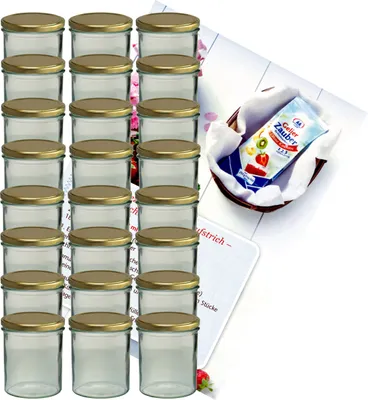 A set of glass jars with gold lids, along with a small basket containing a packet of jelly powder and a recipe booklet.