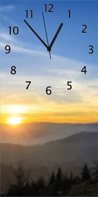 Produktbild von Wallario Design Wanduhr bedruckt, Größe 30 x 60 cm, Motiv: Sonnenaufgang über dem Schwarzwald
