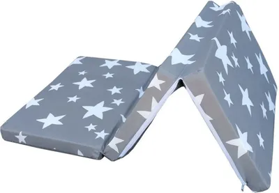 A folded mattress with a star pattern on a white background.