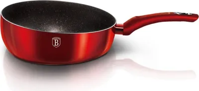 A red wok pan with a black interior and a red handle, shown on a white background with a reflection.