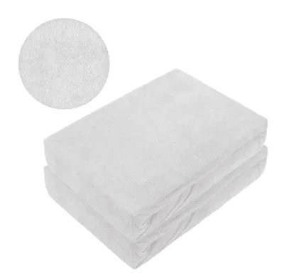 Two stacked white terry cloth fitted sheets with a close-up inset of the fabric texture.