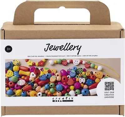 A cardboard box containing a craft kit for making jewelry, with colorful beads and elastic string visible.