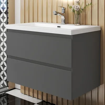 A modern bathroom vanity with a sink and drawers.