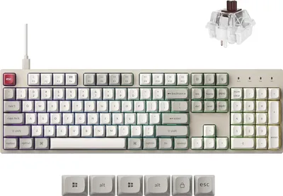 A white mechanical keyboard with a mechanical switch shown above it, and extra keycaps below.
