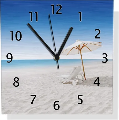 Produktbild von Wallario Design Wanduhr Sonnenliege am weißen Strand unter blauem Himmel aus Aluverbund, Größe 30 x 30 cm