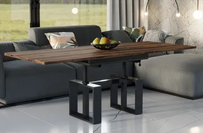 A modern living room with a sofa, coffee table, and ottoman.
