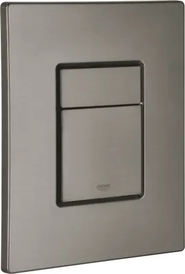 A close-up, studio shot of a flush plate for a toilet.