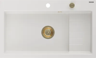 A top-down view of a white granite kitchen sink with a gold drain and faucet.