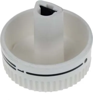 A white appliance knob with black markings.