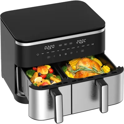 A dual-chamber air fryer with food in both baskets, displayed on a white background.