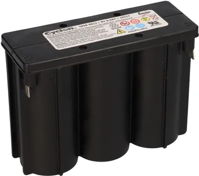 A black battery pack with a label on top, isolated on a white background.