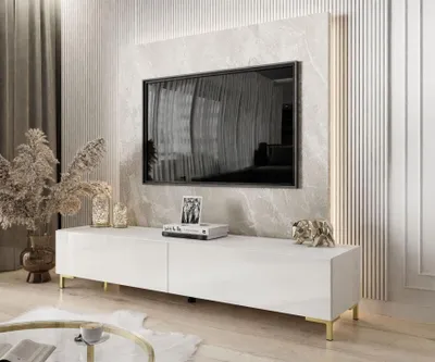 A modern living room with a TV stand and a television mounted on the wall.