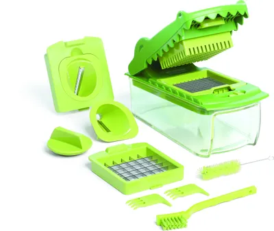 A set of green plastic kitchen tools, including a vegetable chopper shaped like an alligator, are arranged on a white background.