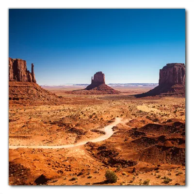 Produktbild von Wallario selbstklebende Möbelfolie/ Tischdecke für Innen und Außen, Größe: 90 x 90 cm - Monument Valley unter blauem Himmel