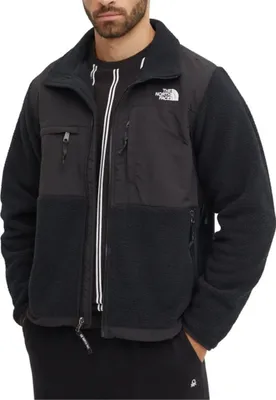 A man wearing a black The North Face jacket.