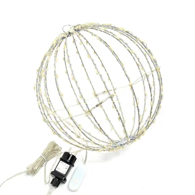 A spherical wireframe light decoration with attached LED lights, a power adapter, and a remote control, displayed against a white background.