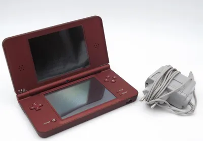 A Nintendo DSi XL handheld game console and its charger are displayed on a white background.