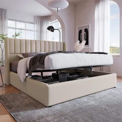 A beige upholstered bed with its storage compartment open, showcasing the metal frame and storage boxes, in a well-lit bedroom.