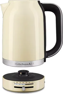 A cream-colored KitchenAid electric kettle and its base are shown against a white background.