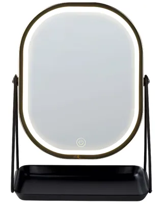 A lighted makeup mirror with a tray on a white background.